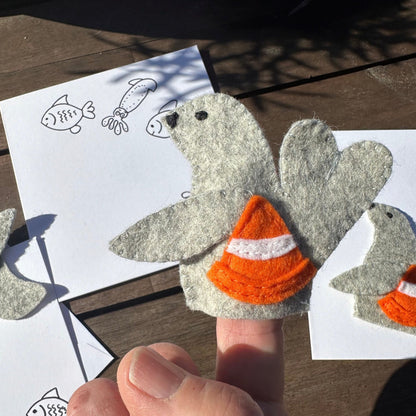 Neil the Seal finger puppet with greeting cardIntroducing Neil the Seal: a finger puppet made with wool felt! Handcrafted in Tasmania, Neil comes with a greeting card for added cuteness. What a playful addition to your puppet collection!Tasmanian Softies