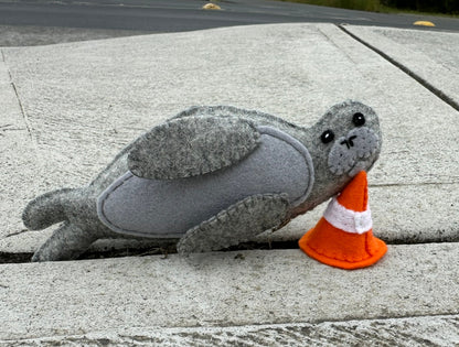 Neil the Seal soft toy with traffic cone made from wool feltNeil the Seal, a loveable Tasmanian character! This soft toy comes with his signature traffic cone, bringing a smile to anyone's face. Made from wool felt.Tasmanian Softies