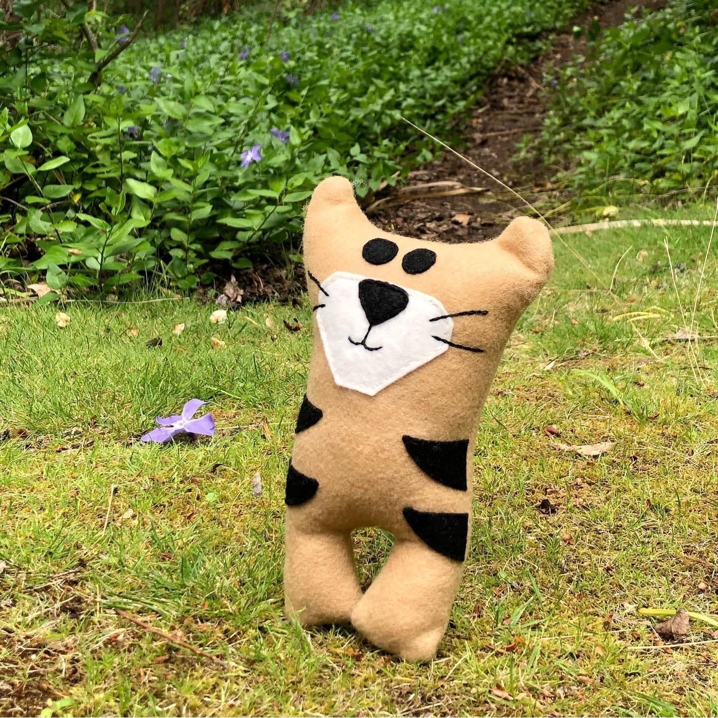 Tasmanian Tiger stuffed toy made from wool felt.Tasmanian Tiger plush toy . We secretly believe they are alive, hiding in the thick bush of Tasmania. Here is your very own Tassie Tiger soft toy. Made from wool felt.Tasmanian Softies