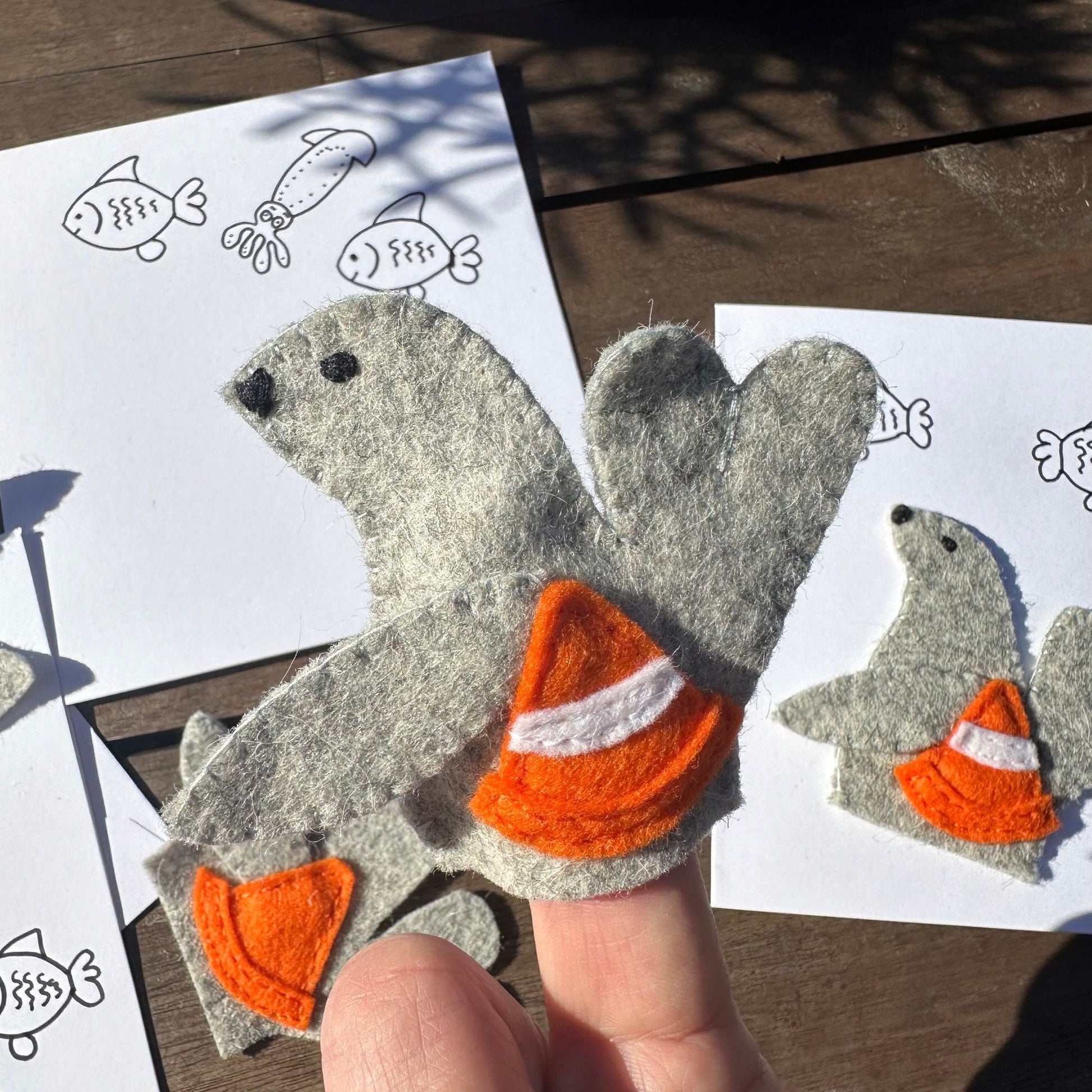 Neil the Seal finger puppet with greeting cardIntroducing Neil the Seal: a finger puppet made with wool felt! Handcrafted in Tasmania, Neil comes with a greeting card for added cuteness. What a playful addition to your puppet collection!Tasmanian Softies