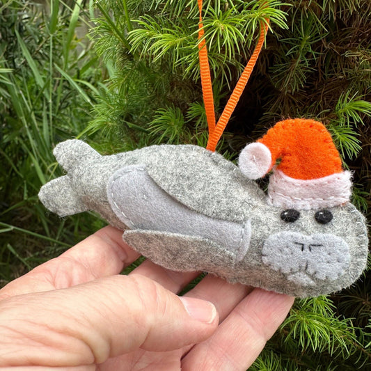 Neil the Seal Christmas decorationIntroducing Neil the Seal, the perfect Christmas decoration handmade in Tasmania with love and care. Crafted from soft wool felt, this charming little fellow will add a touch of whimsy to your Christmas tree.Tasmanian Sof