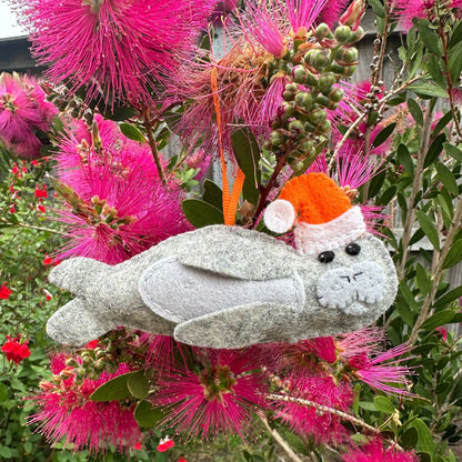 Neil the Seal Christmas decorationIntroducing Neil the Seal, the perfect Christmas decoration handmade in Tasmania with love and care. Crafted from soft wool felt, this charming little fellow will add a touch of whimsy to your Christmas tree.Tasmanian Sof