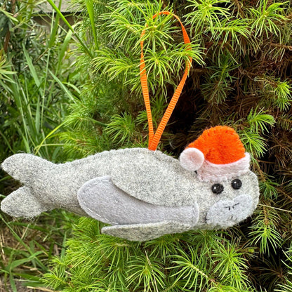 Neil the Seal Christmas decorationIntroducing Neil the Seal, the perfect Christmas decoration handmade in Tasmania with love and care. Crafted from soft wool felt, this charming little fellow will add a touch of whimsy to your Christmas tree.Tasmanian Sof