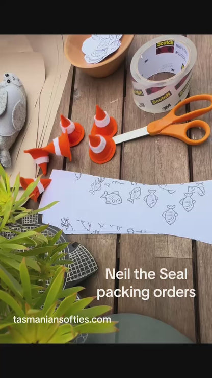 Neil the Seal soft toy with traffic cone